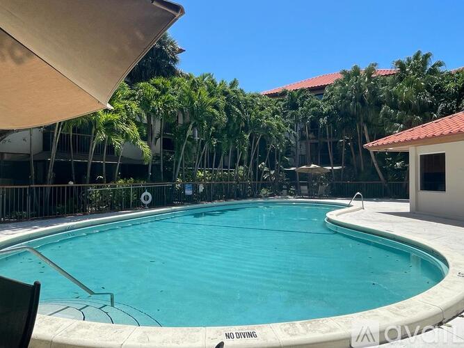 A pool with a no diving sign.