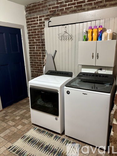 A white oven and microwave are on a kitchen counter.