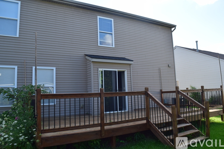 A house with a deck and a window.