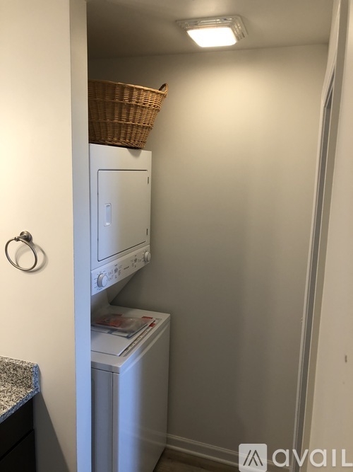 A small laundry room with a washer and dryer.