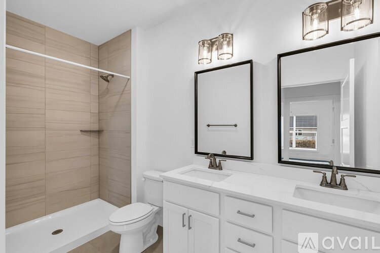 A bathroom with a white toilet, sink, and bathtub.