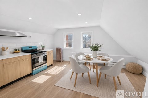 A modern kitchen with a dining table set for four.