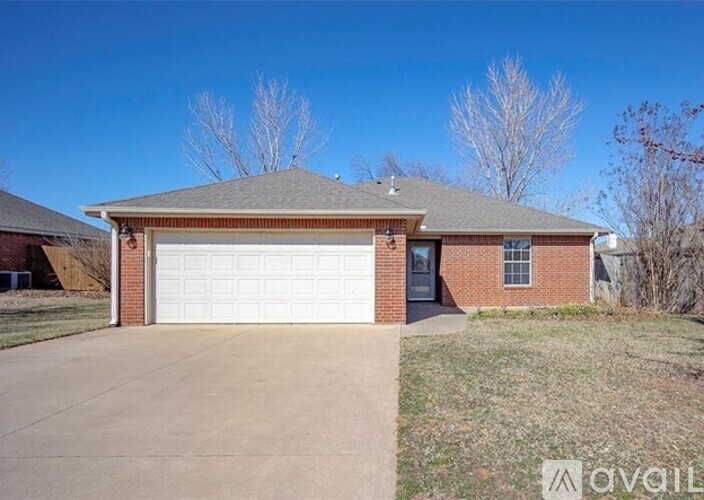 A house with a garage is for sale.