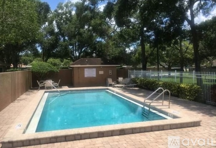 A small pool surrounded by a brick border.