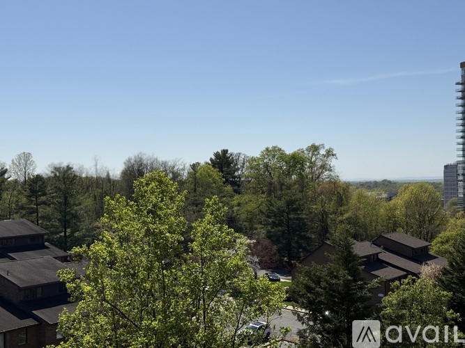 A view of a residential area with houses and trees.