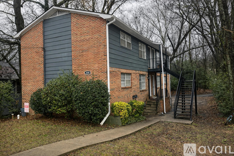 A house with a grey and blue exterior is for sale.