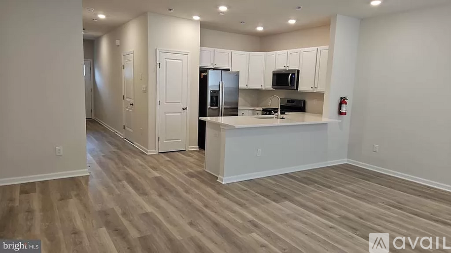 A kitchen area with a countertop and cabinets.
