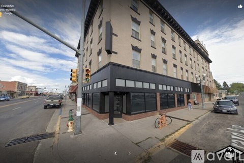 A street view of a building with a bicycle parked in front.