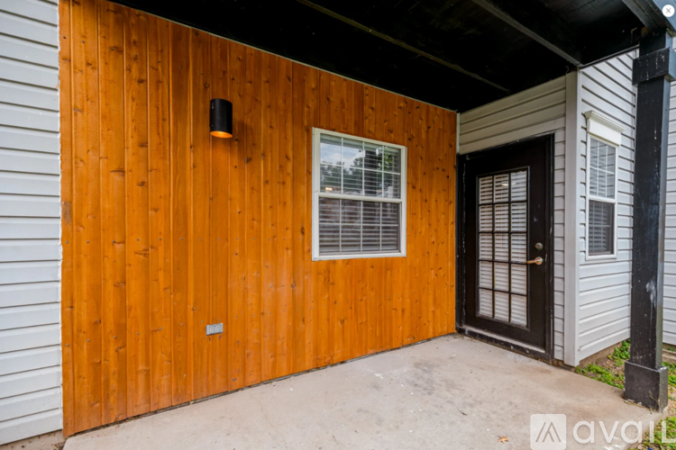 A wooden building with a window and a door.