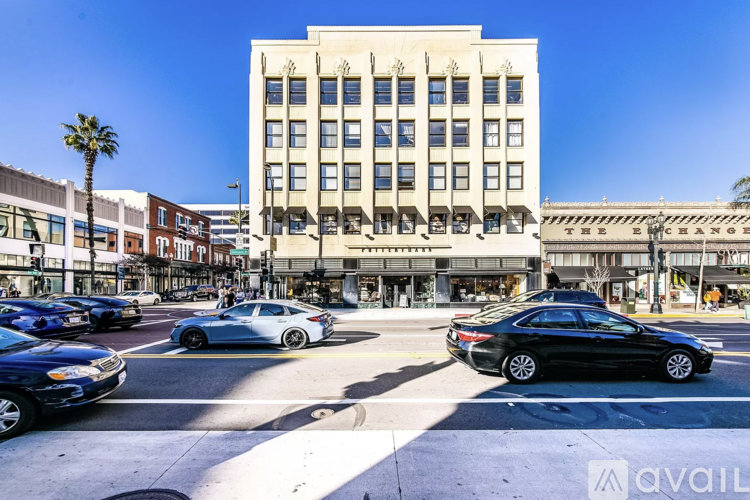 Cars are parked in front of a building with the sign "The Exchange" on top.