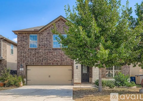 A house with a garage is for sale.