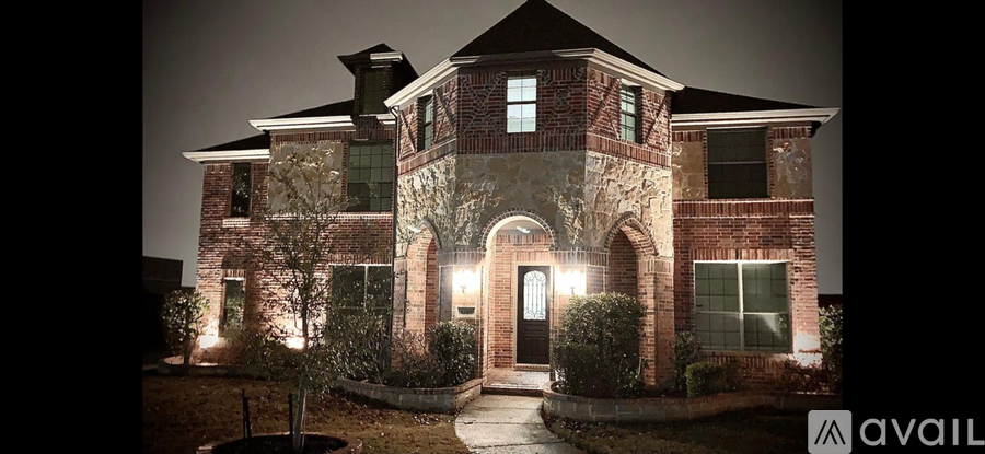 A house with a lit up entrance and a sign that says "available".