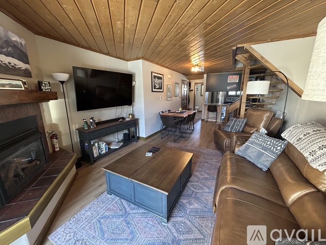A living room with a fireplace and a couch.