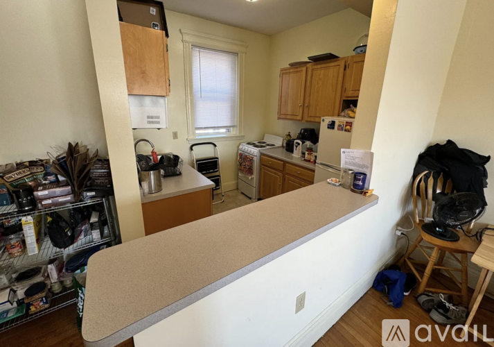 A kitchen with a counter and a window.