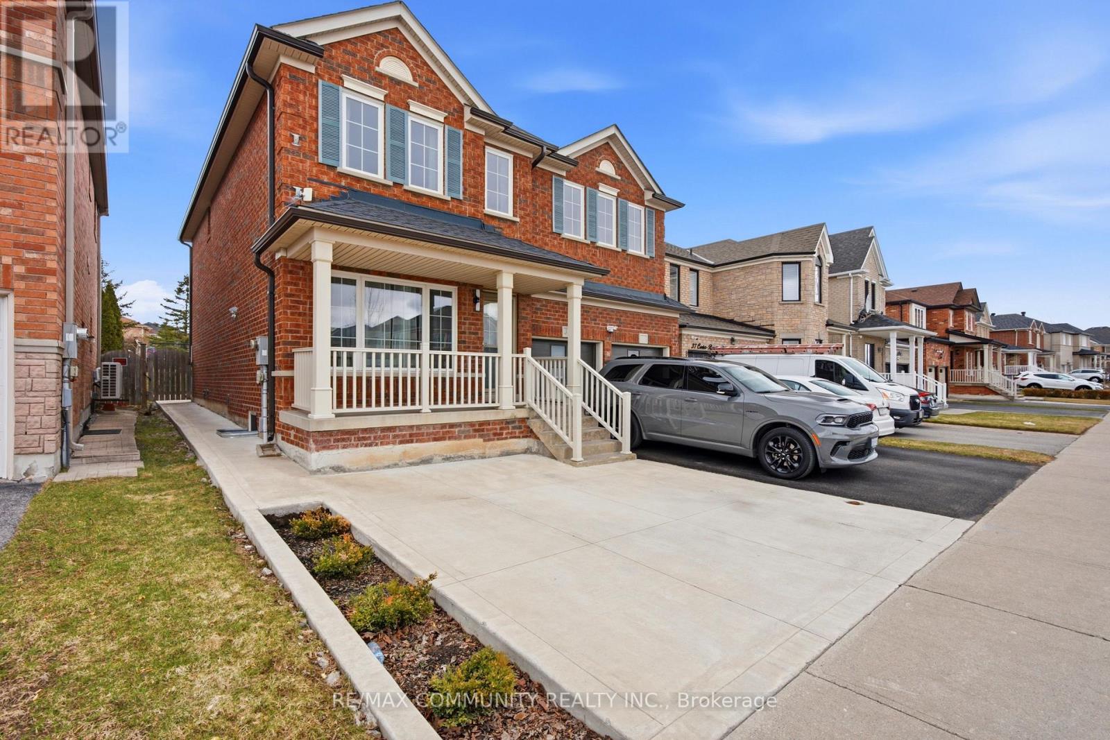 A house with a car parked in front of it.