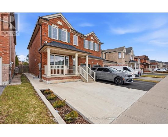 A house with a car parked in front of it.