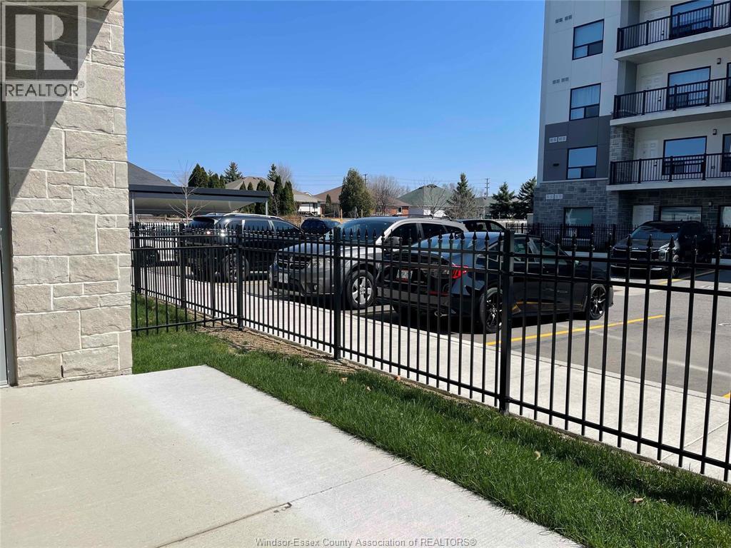 A parking lot with cars and a sign that says REALTOR.