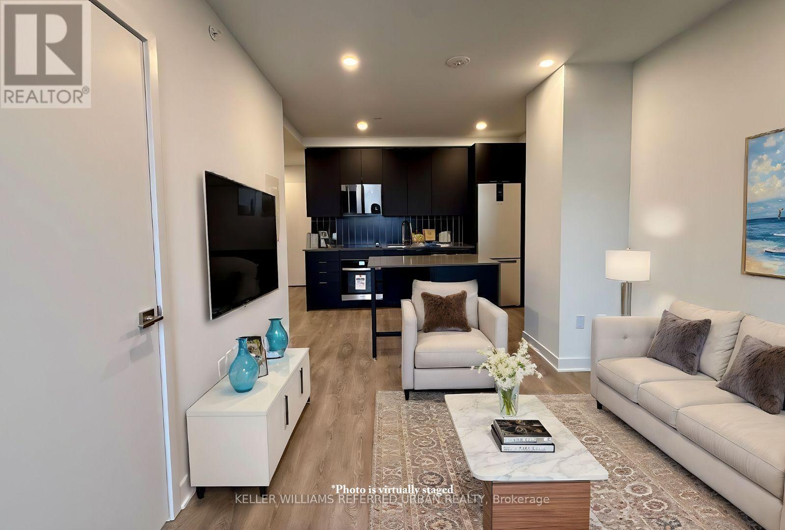 A modern living room with a flat screen TV and a coffee table.