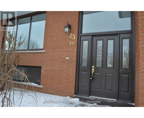 A brown door with a black handle and a number 25 on the wall above it.