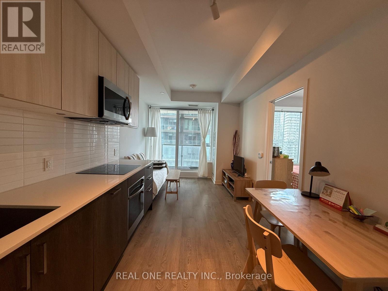 A kitchen with wooden cabinets and a countertop.
