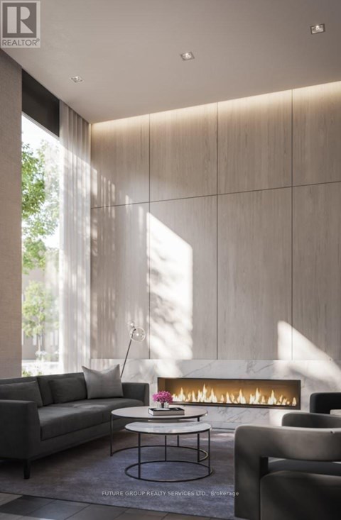 A modern living room with a fireplace and a grey sofa.