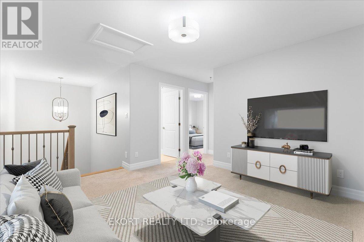 A living room with a grey sofa, a coffee table, and a television on a cabinet.