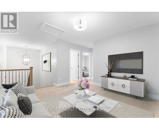 A living room with a grey sofa, a coffee table, and a television on a cabinet.