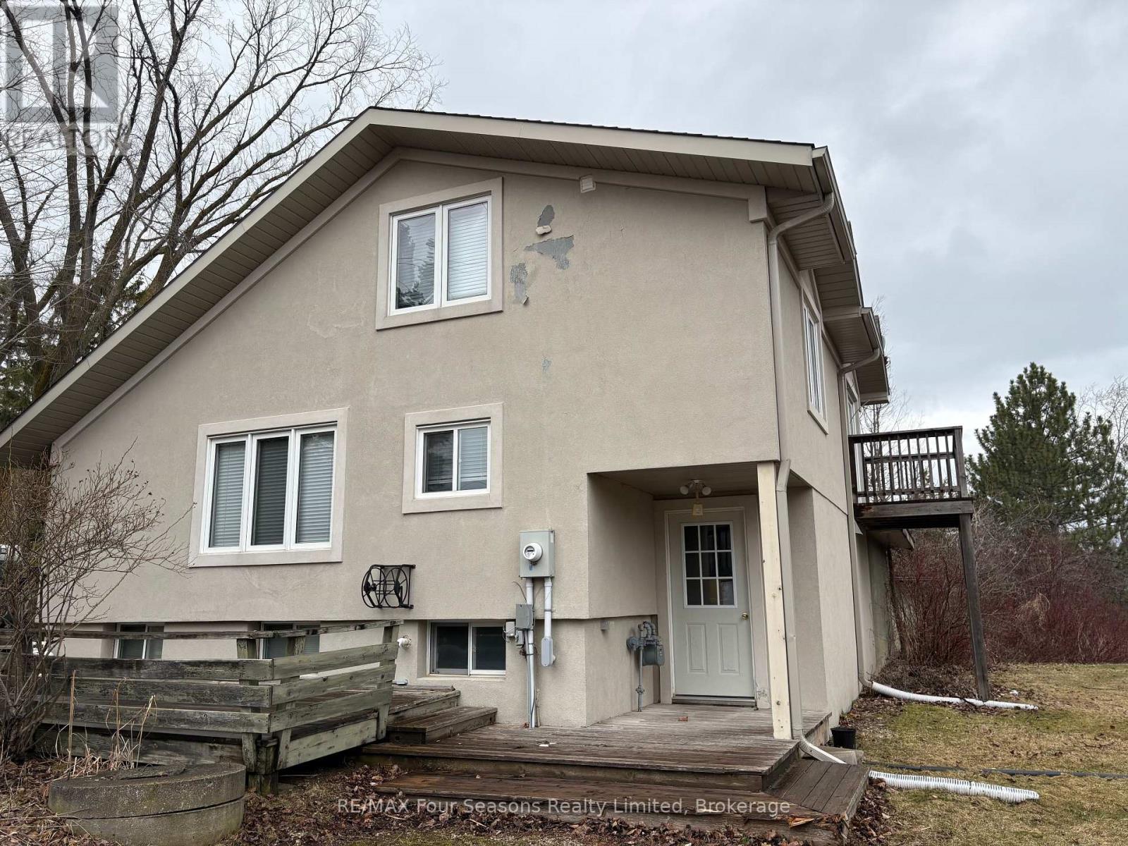 A house with a white door and a small porch.