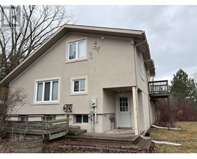 A house with a white door and a small porch.