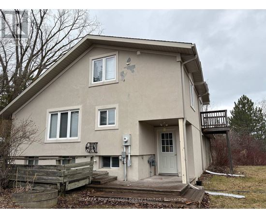 A house with a white door and a small porch.