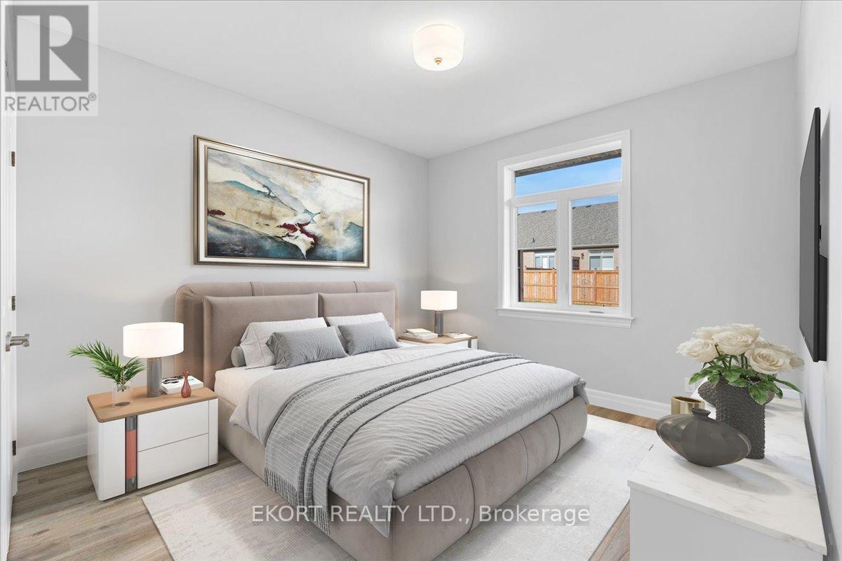 A bedroom with a large bed, a nightstand with a lamp, and a painting on the wall.
