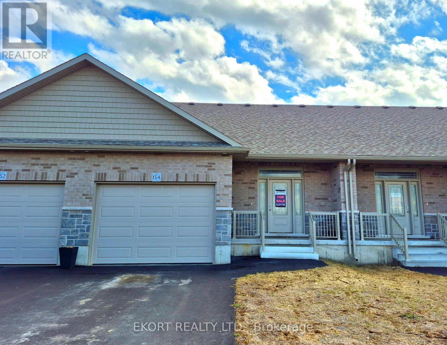 A house with a garage is for sale.