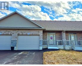A house with a garage is for sale.