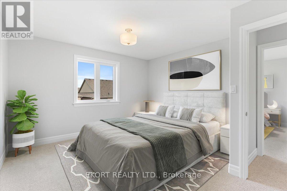 A bedroom with a large bed and a window.