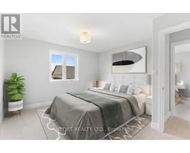 A bedroom with a large bed and a window.