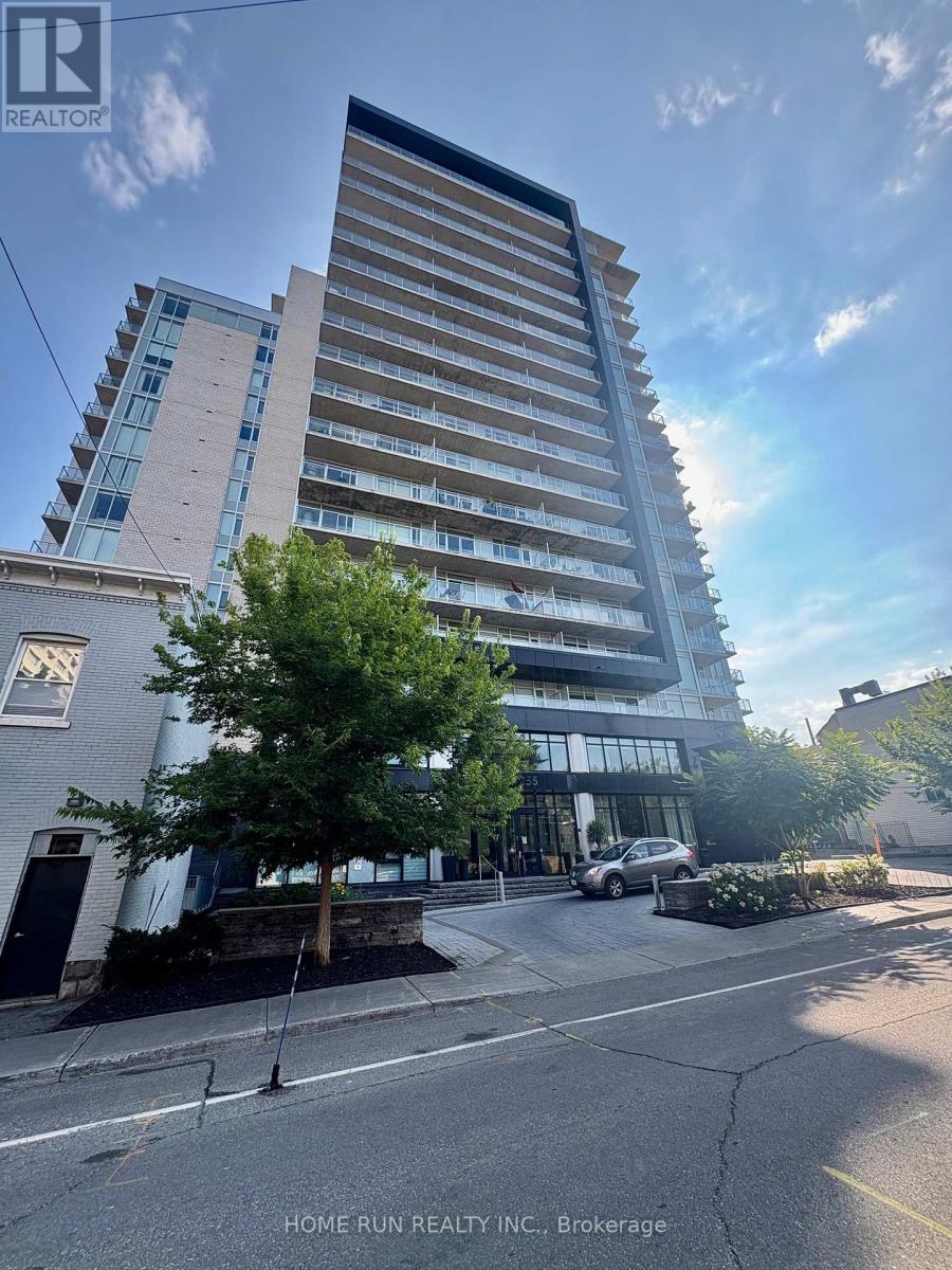 A tall building with a sign that says "HOME RUN REALTY INC., Brokerage" in front of it.