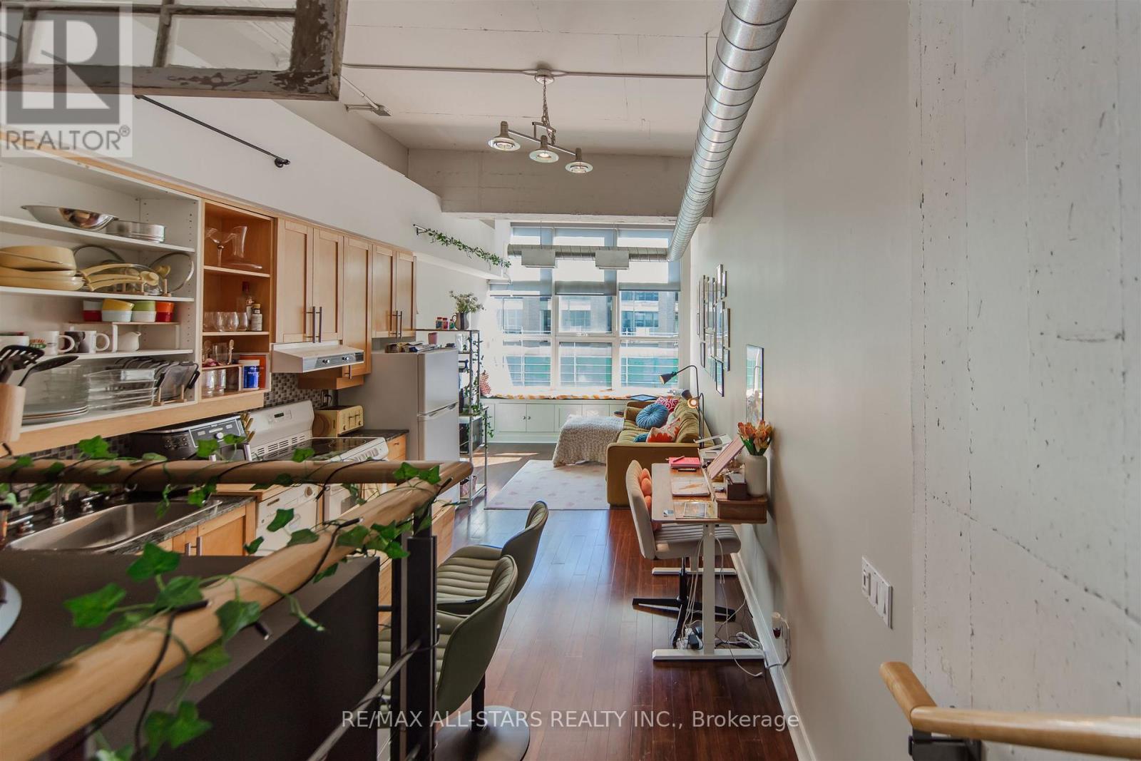 A kitchen with a table and chairs in the middle of it.