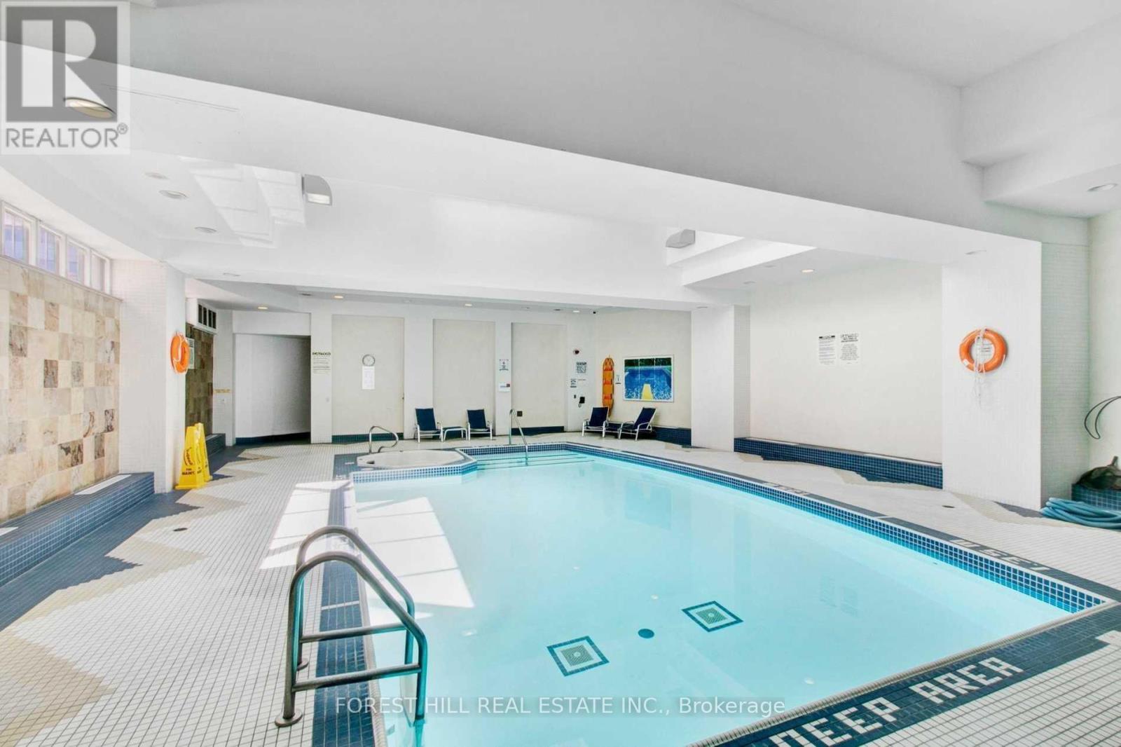 A swimming pool with the words deep reach written on the bottom.