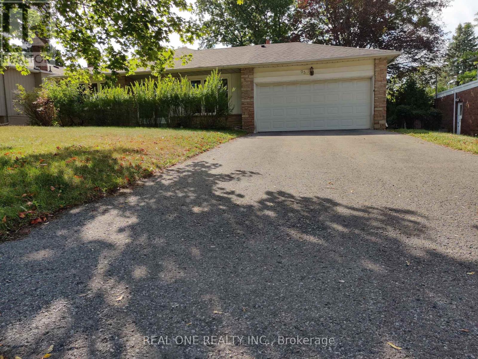 A residential property with a garage and a driveway.