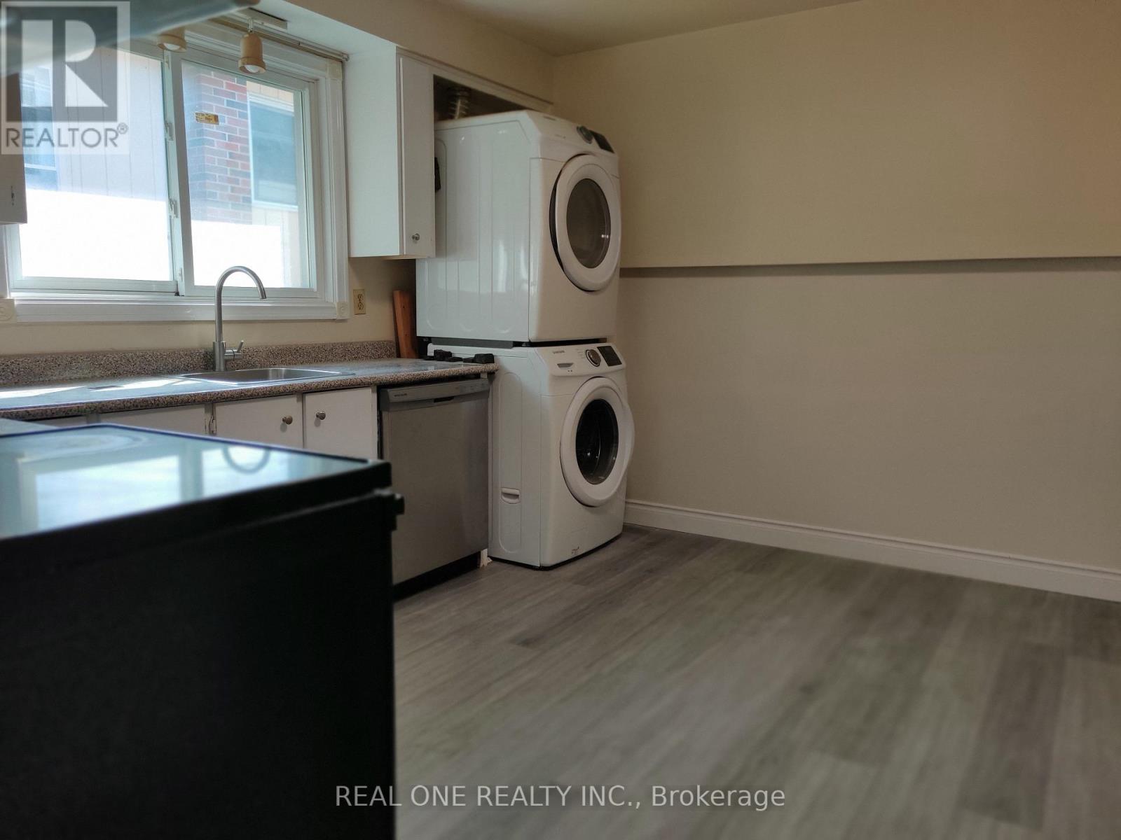 A laundry room with a washer and dryer.