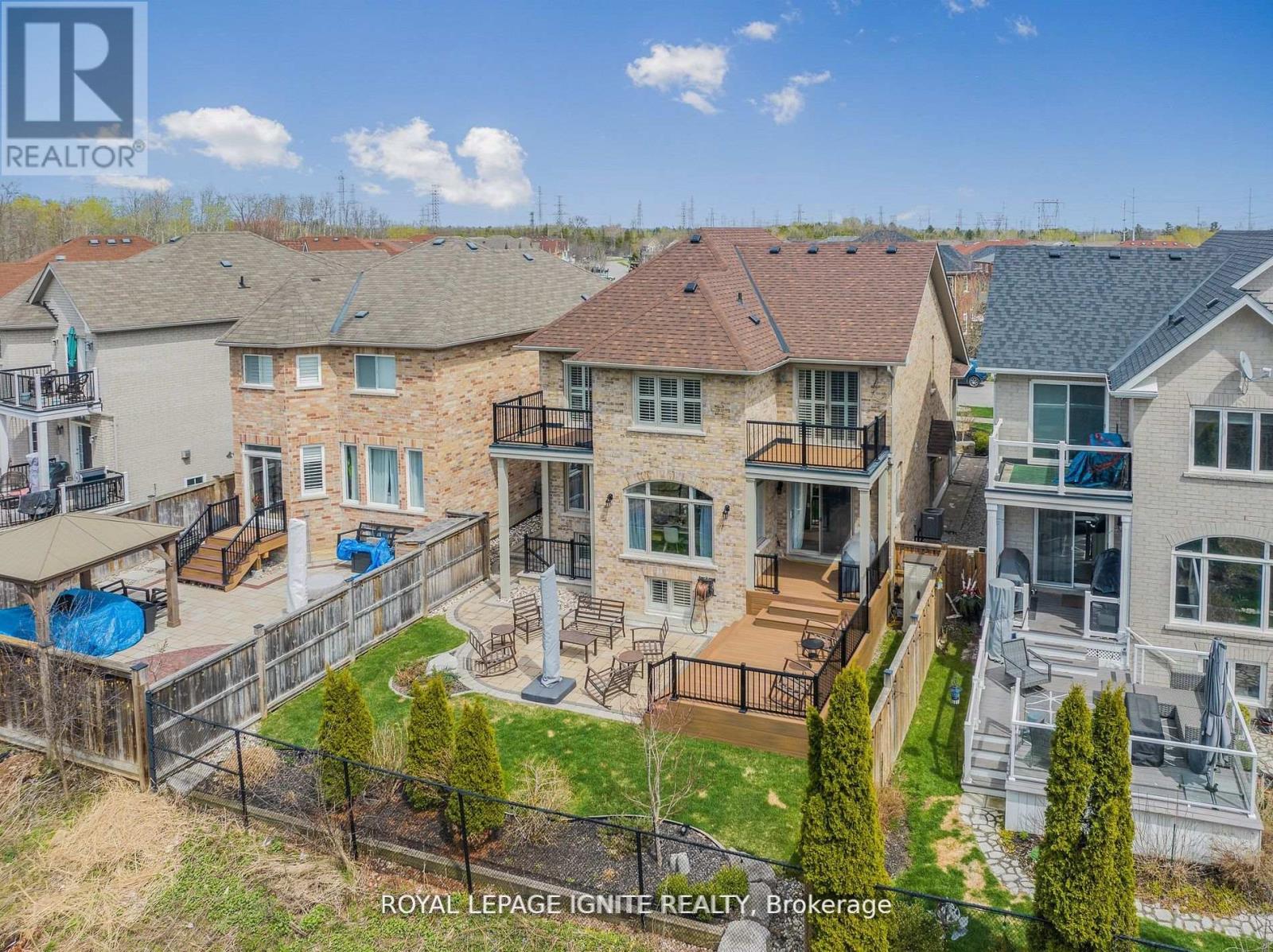 A bird's eye view of a residential area with houses and a pool.