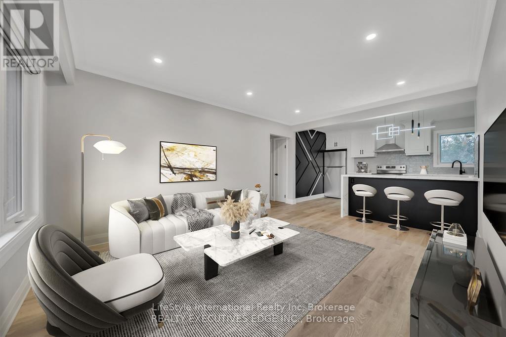 A modern living room with a grey and white color scheme.
