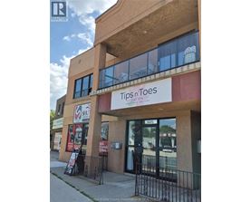 A building with a Tips n Toes Day Spa sign on the front.