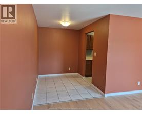 A room with orange walls and a tiled floor.