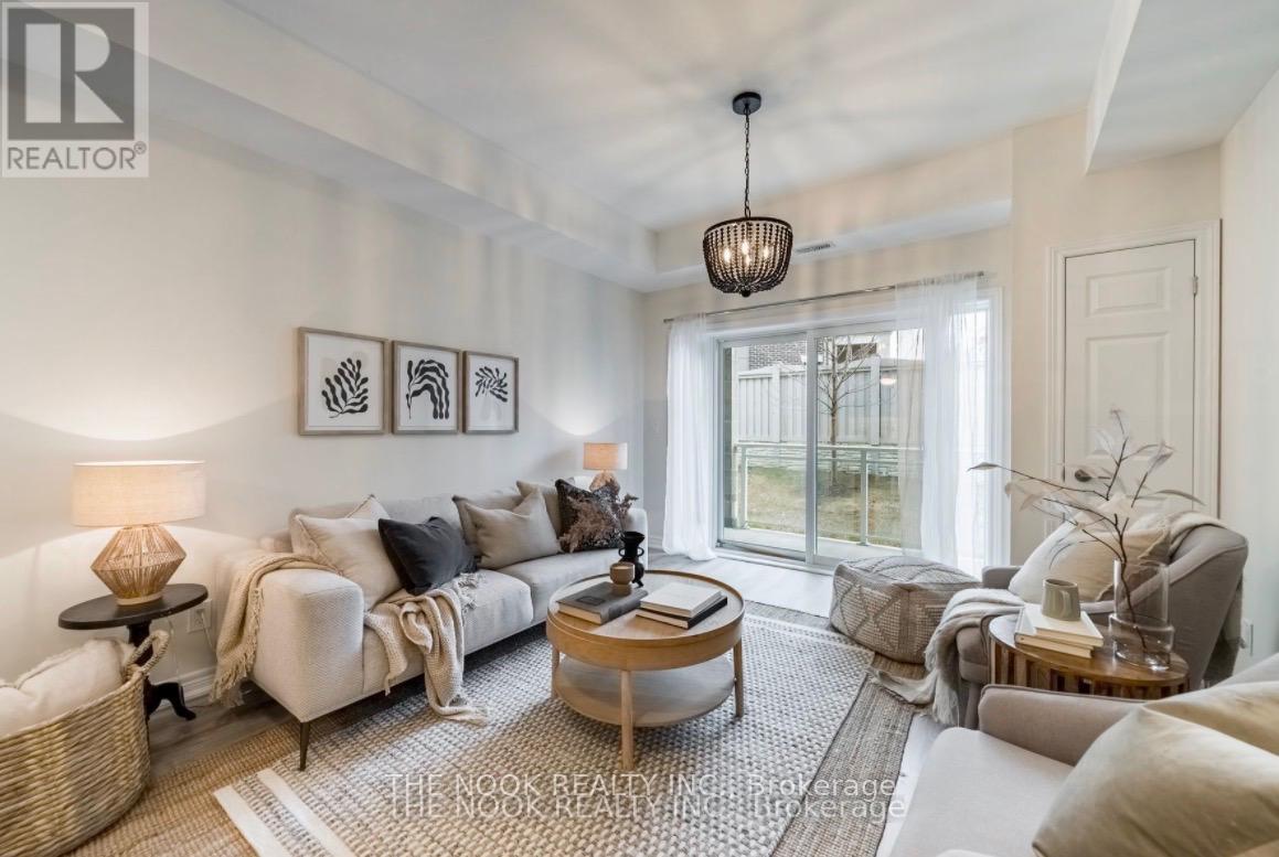 A living room with a sofa, armchair, and coffee table.