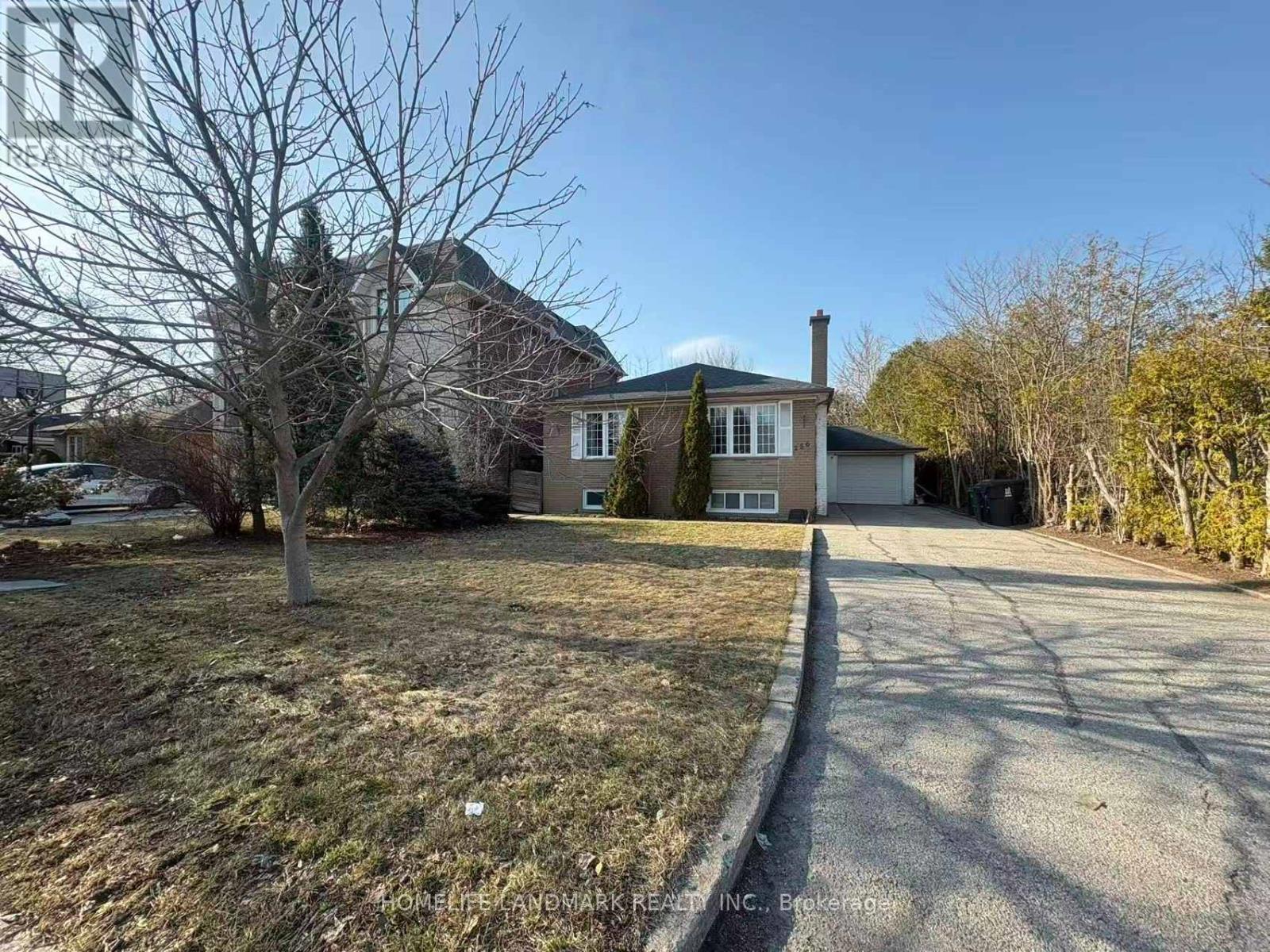 A house with a driveway in front of it.