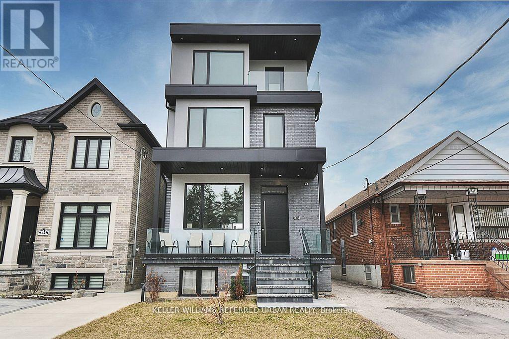 A modern two-story house with a balcony is for sale.