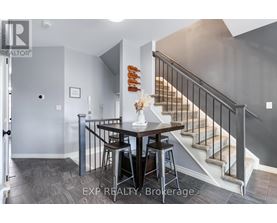 A dining area with a table and chairs is shown in the image.