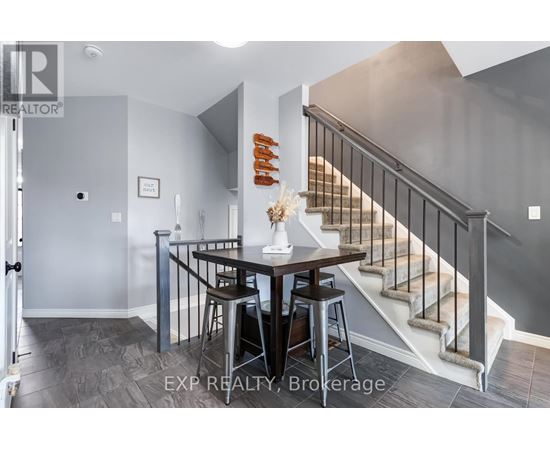 A dining area with a table and chairs is shown in the image.