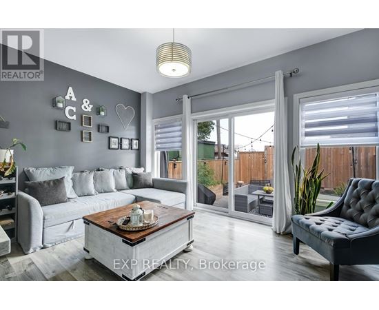 A living room with a grey couch and a coffee table.